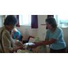 Churchwarden Sara at her cake stall
