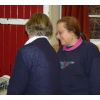 Pat showing Linda how to use the Cuttlebug