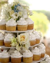 Cupcake tower topped with fresh flowers 