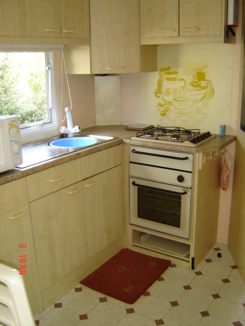 kitchen area in the above caravan mobile home