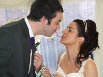 Bride and Groom have fun with Strawberry laces at their candy buffet table with 35 varieties