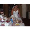The bride enjoys her wedding sweetie table with 35 varieties
