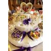 The 3-Tier cake-style centrepiece will be decorated in your colours.  The photo can be replaced with sweets if you prefer.