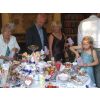 Filling sweet bags with yummy sweets, chocolates and candy from the sweets buffet table with 30 varieties at Hazlewood Castle.  Real silver serving tongs and spoons for hygienic self selection.