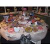 36 varieties Wedding sweets table with black, ivory and wine colours. Silver service sweets and candy banquet on a 5' diameter table.