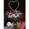 A gorgeous diamante heart tops this wedding sweets buffet table with 35 varieties