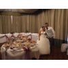 Lucy and Nicky ready to let their guests loose on their wedding candy sweets buffet table with 35 varieties