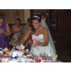 The bride tucks into her sweety buffet table with 36 varieties at Hazlewood Castle near Leeds.