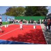 Kids enjoying Tennis & christening the court.