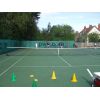 Juniors take on the automatic ball feeder to try & knock over the cones.