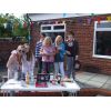 Helen tries to persuade her sister's family to join the Club.
