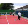 Tom Cox coaches mini-tennis