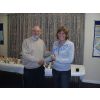 Jean Parry receives the Mixed Doubles trophy she won with husband Ian.