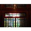 Finished glass in place within large Victorian door frame
