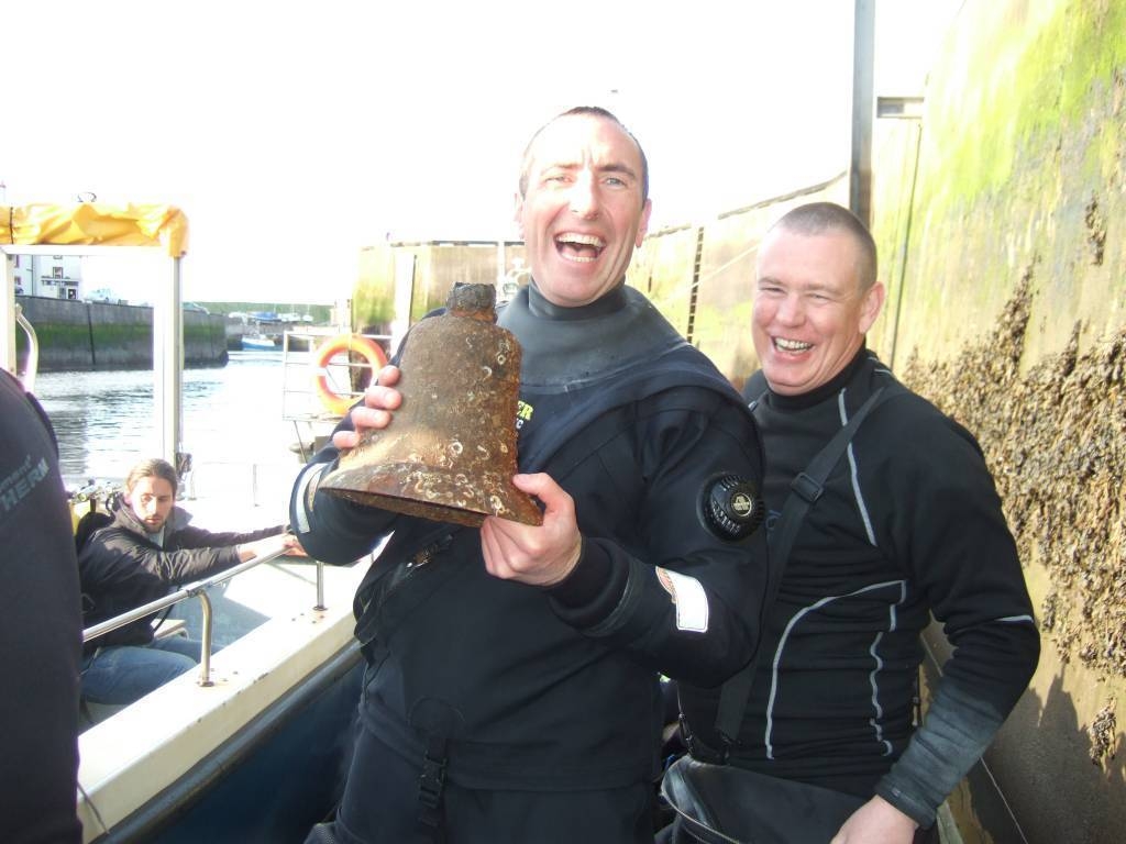  mark oneil with the bell from virgin wreck found last week 28 miles off shore