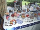 half of a 30 varieties sweets table showing a selection of spoons and bags