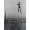 A hop picker (Jack Martin) on stilts, for tying up the hops.