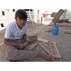 Young workman making furniture, in village near Bhuj, Gujarat, India.