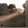 Young boys play cricket at end of the day, in sandy street near Bhuj, Gujarat, India.