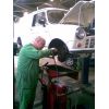 John working on the front end. Brakes, transmission and the inevitable rubber covers.
Oh Look! another one's split. Doh!