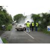 Wyn Humphries and Robert Fagg with car alight - Kella crossroads