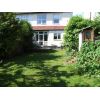 Garden showing old garage taking up a third of the width.