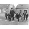 Crossing the road to go to School with the local "Bobby" It probably dates from 1967.