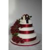 Cascading roses on wedding cake .