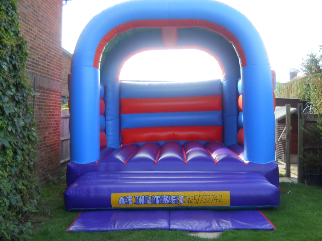 15 ft x 17 ft blue and orange adult bouncy castle