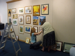  Arts society putting up paintings
