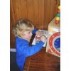 child doing a wooden puzzle